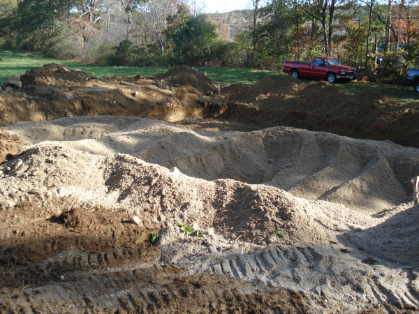 Custom home builder Southborough MA add sand to leach field