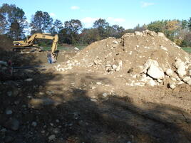 Digging new old home foundation hole.
