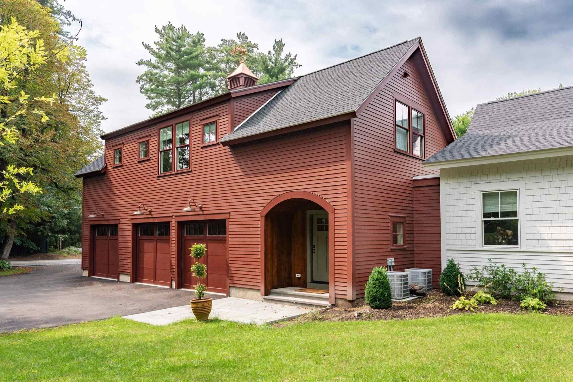 Image of a home addition with second-story living space and a three car garage in central MA by Gilmore Building Company Image of a home addition with second-story living space and a three car garage in central MA by Gilmore Building Company