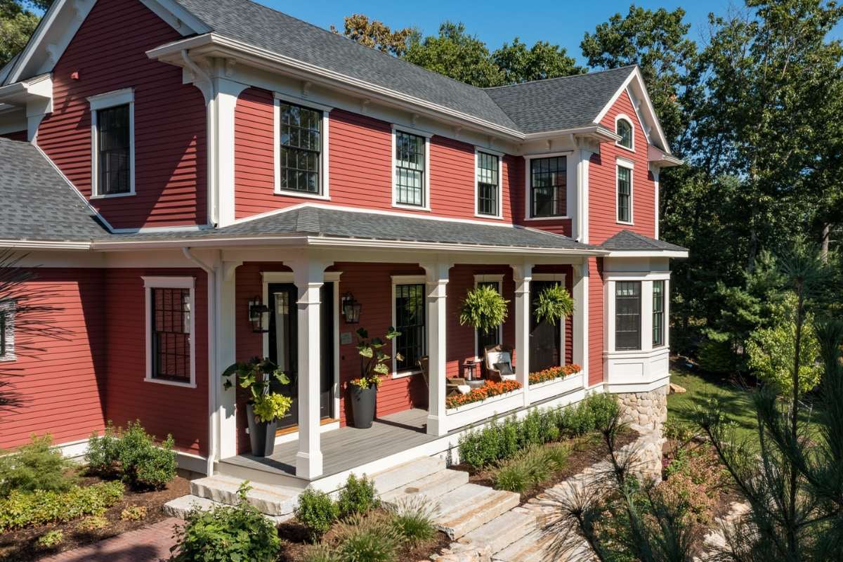 Exterior shot of a two-story custom home with porch built by Gilmore Building Co Exterior shot of a two-story custom home with porch built by Gilmore Building Co