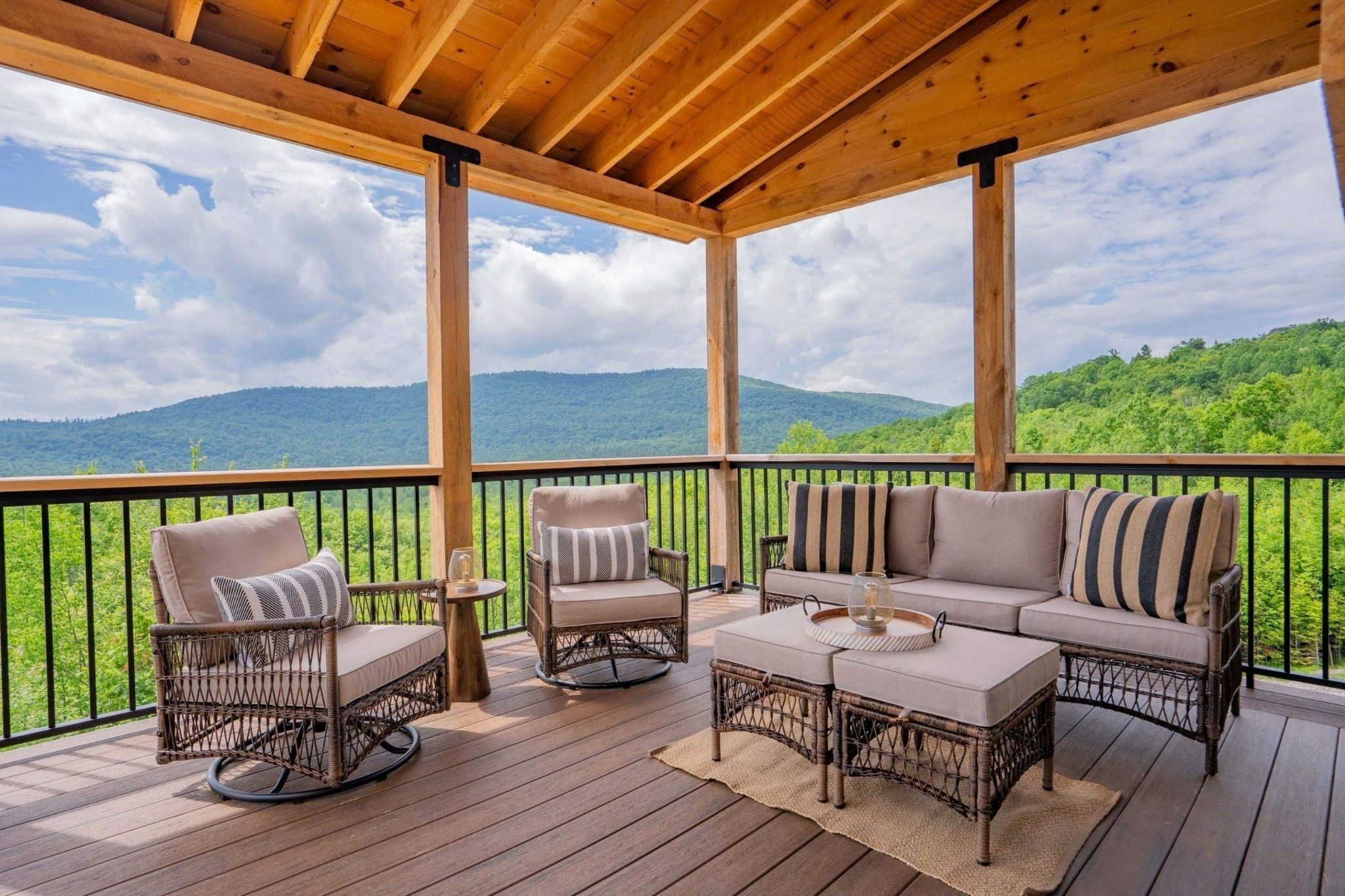 Covered deck on a Central Massachusetts custom home overlooking mountains by Gilmore Building Co