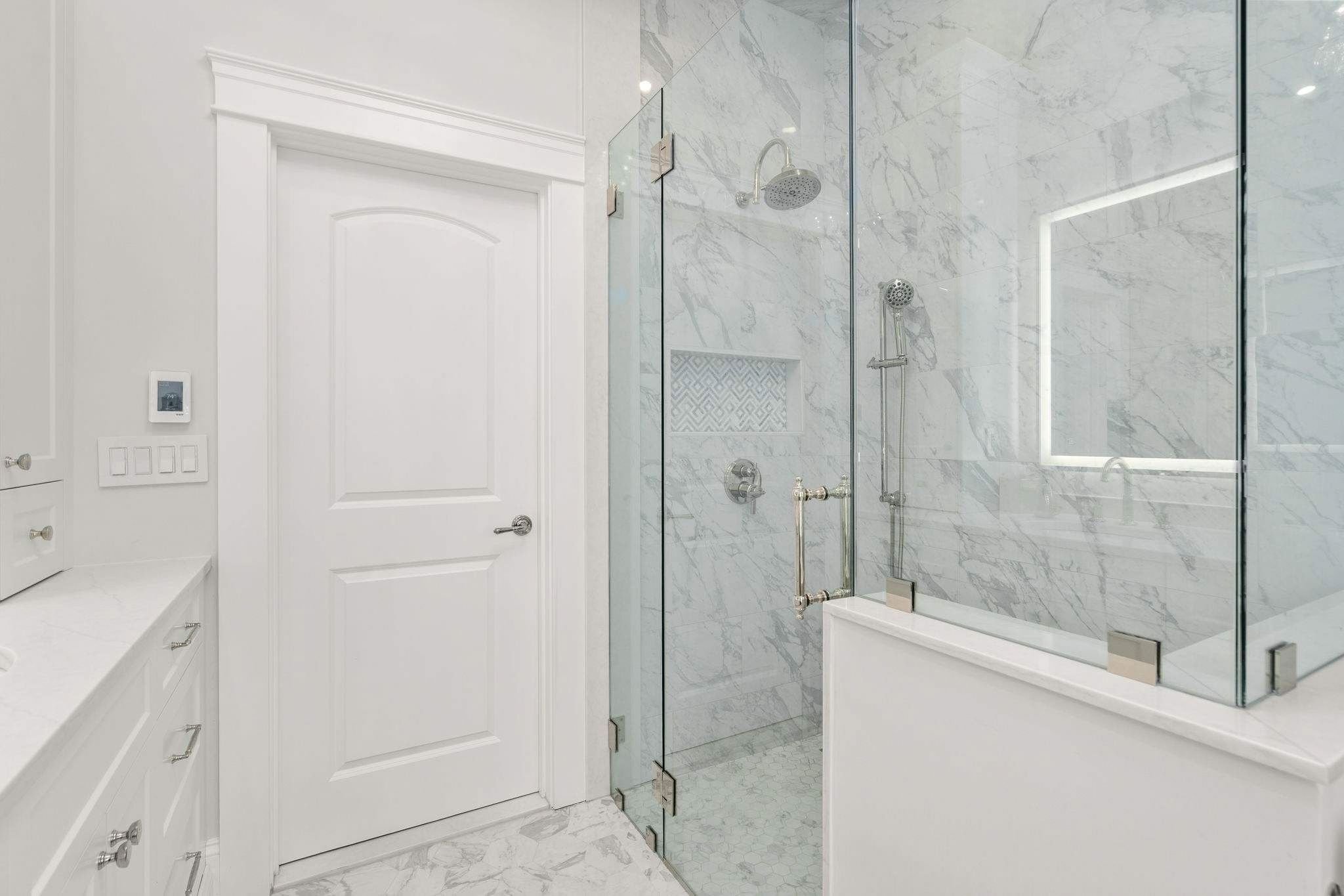 Custom bathroom in a home remodel with an oversized glass shower by Gilmore Building Co. in Grafton, MA