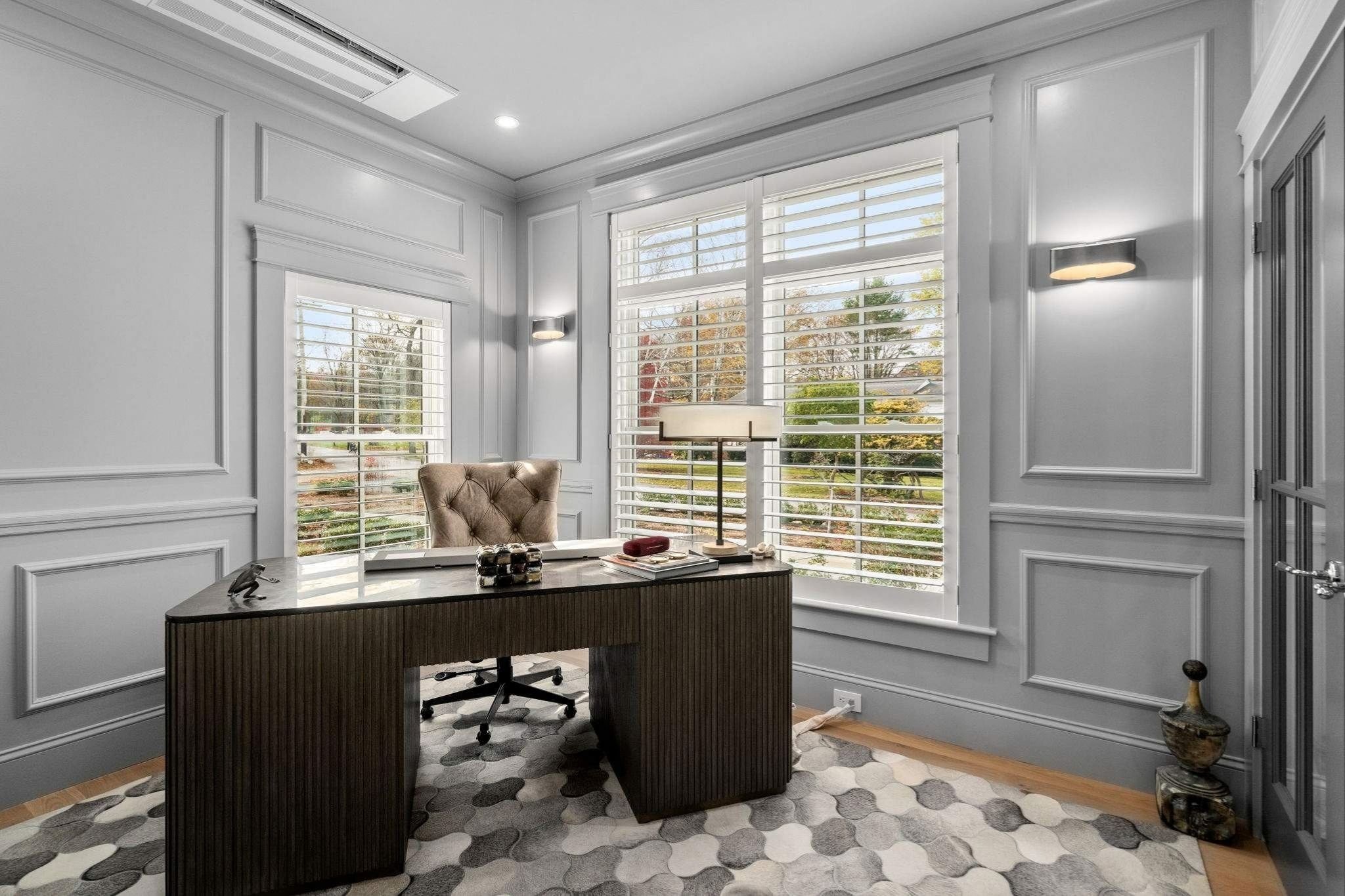 Home office in a custom home with custom trim and gray walls by Gilmore Building Co. in Grafton, MA