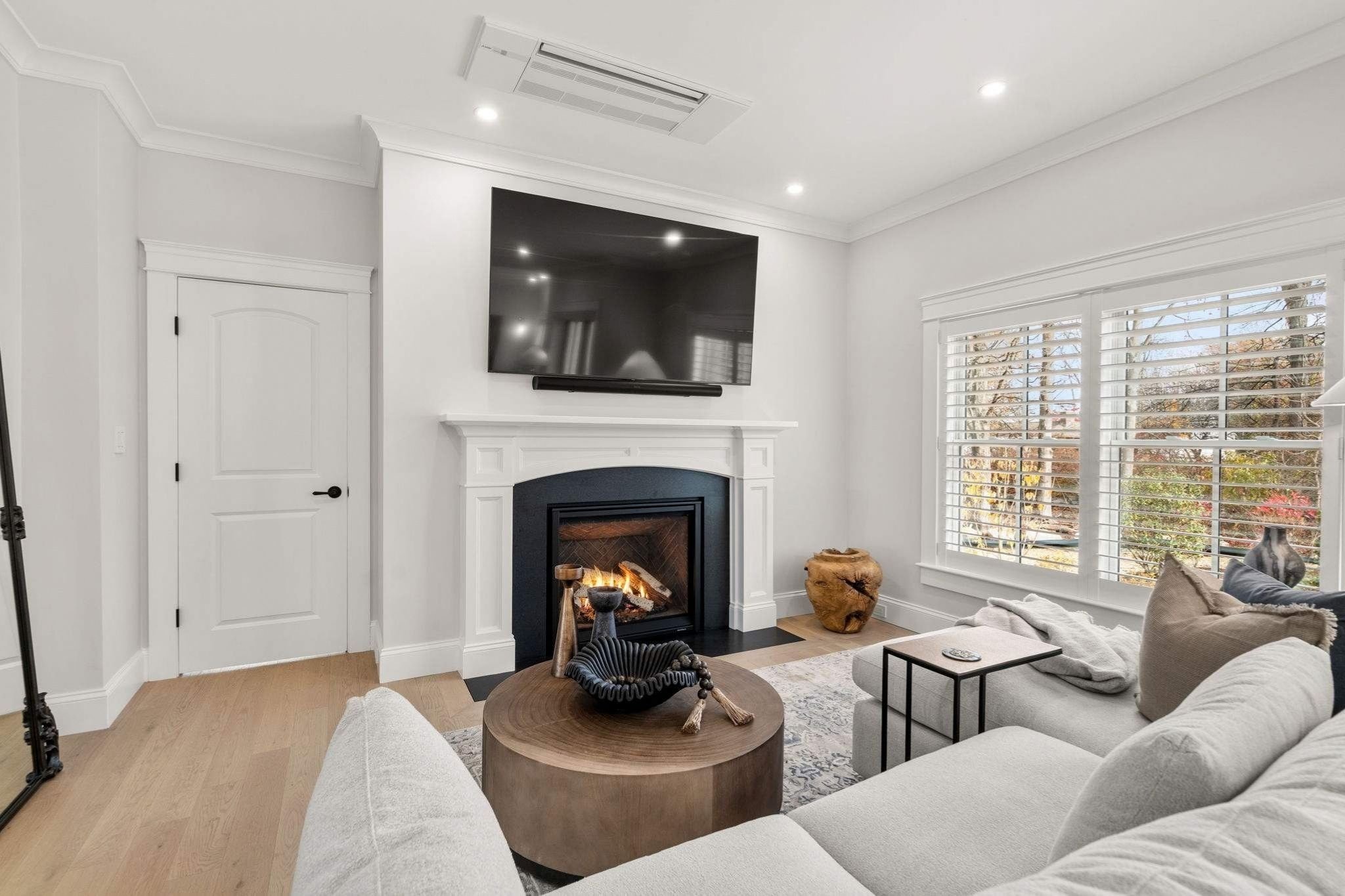 Living room a Central Massachusetts whole home remodel with a fireplace by Gilmore Building Co