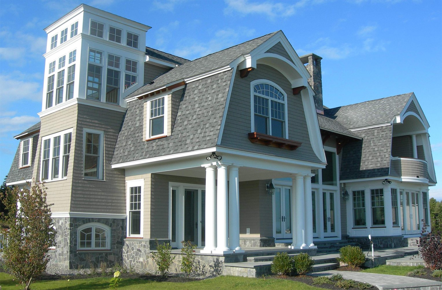 Photo of beach front shingle style home 