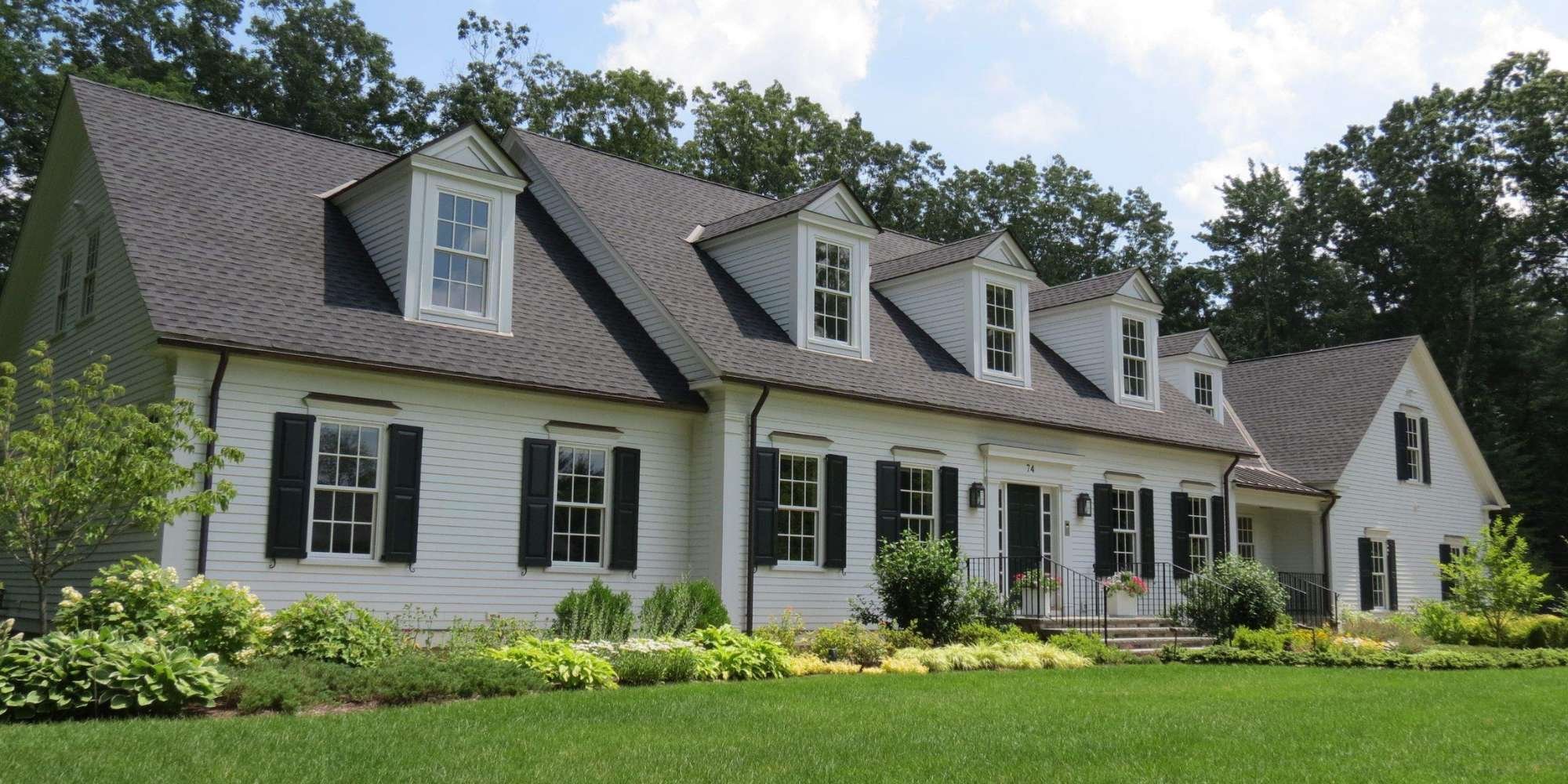 Image of a custom New Englan-style home with window shutters by Gilmore Building Co in Grafton, MA