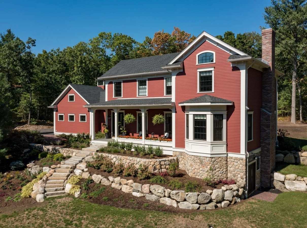 Image of a New England-Style custom home remodel by Gilmore Building Co. Image of a New England-Style custom home remodel by Gilmore Building Co.